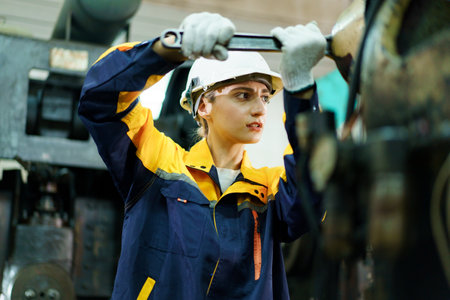 Professional female mechanical engineer is perform inspection and quality check of raw materials in...