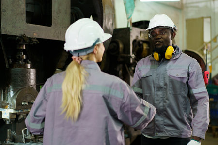 Team of technicians or engineers are inspecting machines in the factory. Engineers team arrange...