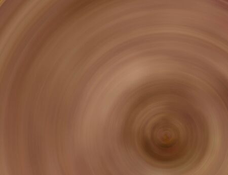 Wet clay rotating on the spinning wheel in a pottery. Fine background for art related text or products.の写真素材