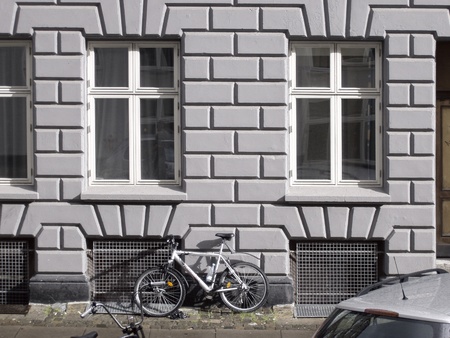 Two windows in an old city houseの写真素材