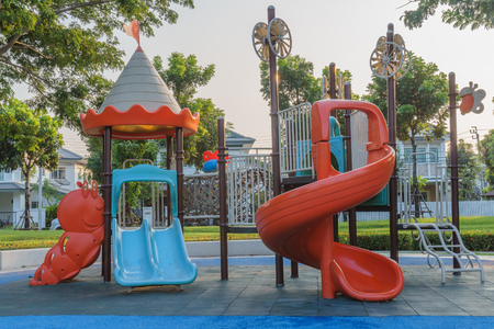 A colorful public playground in a gardenの写真素材