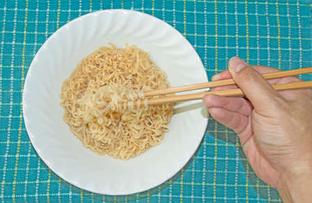 First Person View - use chopstick to eat Instant Noodleの写真素材