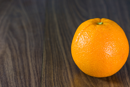 Orange fruit on wooden background.の写真素材