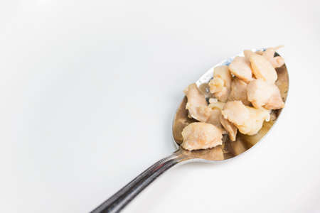 chicken ripe in the spoon isolated on white.