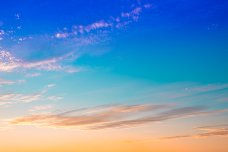 Bright orange mix blue colors sunset sky.の写真素材