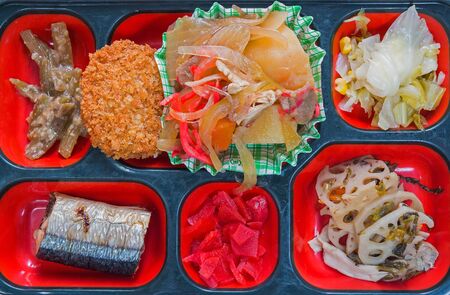 Japan Food set of grilled fish and other in a box isolated on white  Japan food Bento.の写真素材