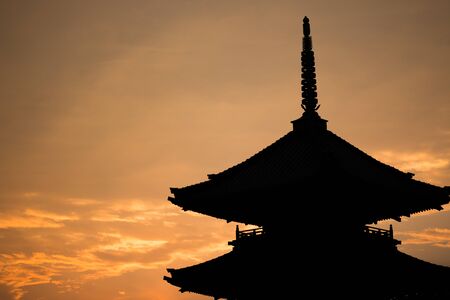 Japanese Temple Silhouette During Sunset in Japanの写真素材
