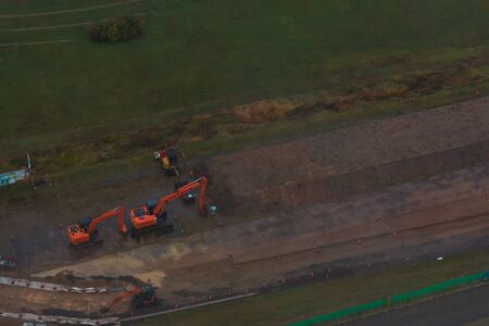 Wheel loader excavator working construction site, on top view.