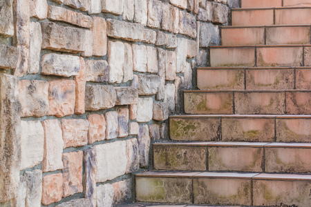 Tile dirty stairs with stone brick wall.の写真素材