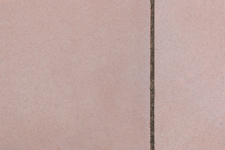 Texture of soft pink color concrete wall with vertical groove line.の写真素材
