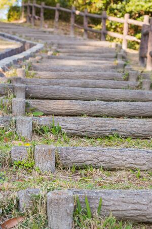 Wooden stairs on hill pathway curve.の写真素材