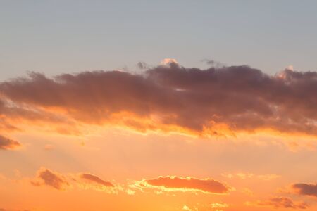 Bright sky orange and yellow colors sunset time.の写真素材