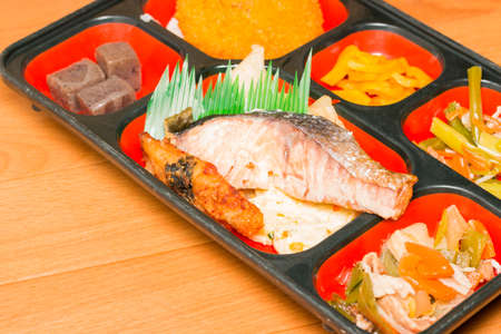 Japan Food set of salmon grilled and other in a box.の写真素材