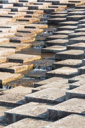 Art concrete block, level different and mini waterfall in center.の写真素材