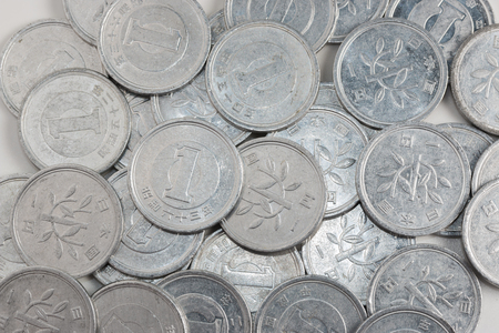 Pile of 1 yen coins japanese money, close up isolated on white background.の写真素材
