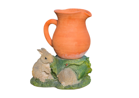 Earthenware vase with rabbit plaster on white background.の写真素材