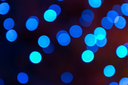 Abstract light celebration blur background with defocused, blue lights.