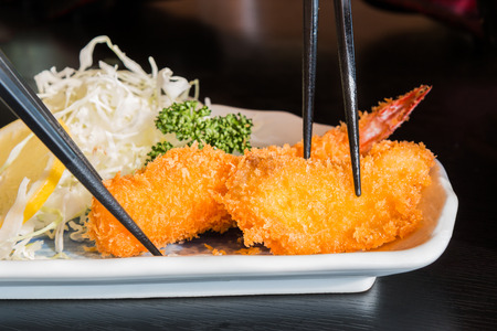 Fried prawn balls, shrimp fritter with lemon and cabbage slice.の写真素材