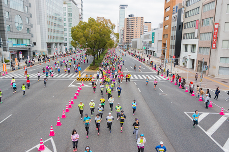 NAGOYA, JAPAN - MARCH 13, 2016: Nagoya Women's Marathon 2016. Women's With more than 3,000 People running in the downtown. Course Start and finish at Nagoya Dome Distance 42.195km. Nagoya city Japan.のeditorial素材