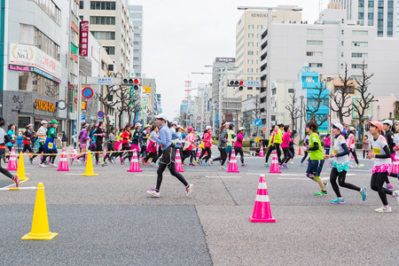 NAGOYA, JAPAN - MARCH 13, 2016: Nagoya Women's Marathon 2016. Women's With more than 3,000 People running in the downtown. Course Start and finish at Nagoya Dome Distance 42.195km. Nagoya city Japan.のeditorial素材