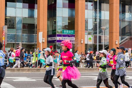 NAGOYA, JAPAN - MARCH 13, 2016: Nagoya Women's Marathon 2016. Women's With more than 3,000 People running in the downtown. Course Start and finish at Nagoya Dome Distance 42.195km. Nagoya city Japan.のeditorial素材
