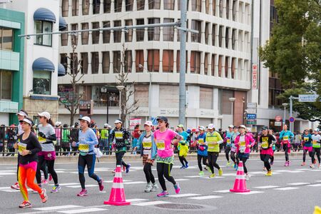 NAGOYA, JAPAN - MARCH 13, 2016: Nagoya Women's Marathon 2016. Women's With more than 3,000 People running in the downtown. Course Start and finish at Nagoya Dome Distance 42.195km. Nagoya city Japan.のeditorial素材