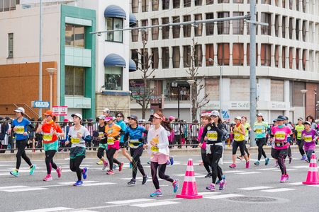 NAGOYA, JAPAN - MARCH 13, 2016: Nagoya Women's Marathon 2016. Women's With more than 3,000 People running in the downtown. Course Start and finish at Nagoya Dome Distance 42.195km. Nagoya city Japan.のeditorial素材