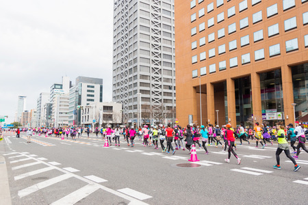 NAGOYA, JAPAN - MARCH 13, 2016: Nagoya Women's Marathon 2016. Women's With more than 3,000 People running in the downtown. Course Start and finish at Nagoya Dome Distance 42.195km. Nagoya city Japan.のeditorial素材