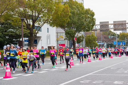 NAGOYA, JAPAN - MARCH 13, 2016: Nagoya Women's Marathon 2016. Women's With more than 3,000 People running in the downtown. Course Start and finish at Nagoya Dome Distance 42.195km. Nagoya city Japan.のeditorial素材