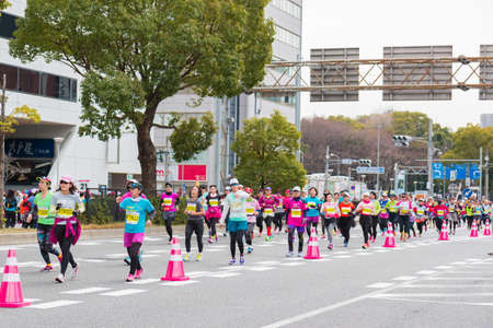 NAGOYA, JAPAN - MARCH 13, 2016: Nagoya Women's Marathon 2016. Women's With more than 3,000 People running in the downtown. Course Start and finish at Nagoya Dome Distance 42.195km. Nagoya city Japan.のeditorial素材