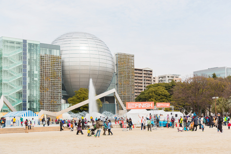 NAGOYA, JAPAN - MARCH 13, 2016: Nagoya city Marathon 2016. People running in the downtown.Half Marathon and Quarter Marathon. Nagoya City Science Museum. Nagoya city Japan.のeditorial素材