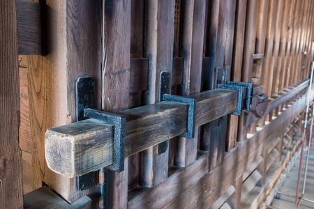 Old prison locked wooden key, wooden gate lockの写真素材
