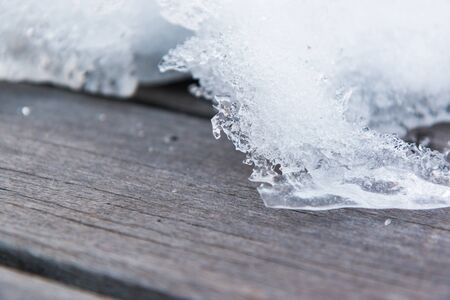 Old wood texture with snow in winter