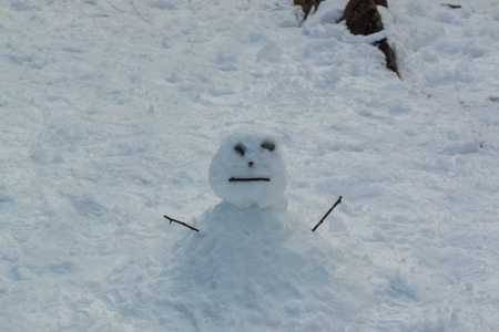 Ugly snowman be built from kid, winter season.の写真素材