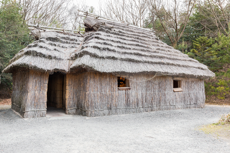 Acient house thatched roof building of Ainu on the island Hokkaido, Japan, circa 1890-1900.のeditorial素材