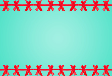 elegant blue background with red bow frame.の写真素材