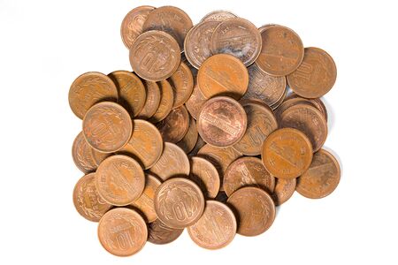 Pile of 10 yen coins japanese money, close up on white background.の写真素材