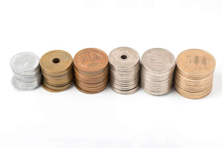 Pile of all coins japanese money, close up on white background.の写真素材