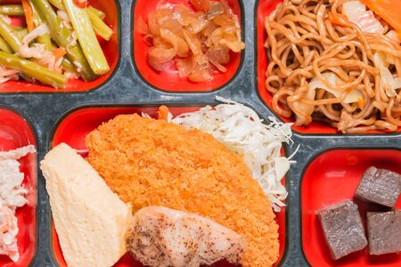 Japan Food set of meat fritter and other in a box. Japan food (Bento).の写真素材