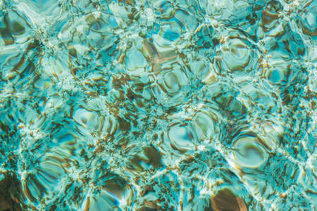 Blue swimming pool water surface texture background.の写真素材