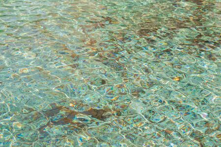 Blue swimming pool water surface texture background.の写真素材