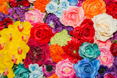 Beautiful multicolored artificial flowers background. flowers decor.の写真素材
