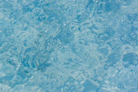 Blue swimming pool water surface texture background.の写真素材