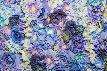 Beautiful blue artificial flowers background. flowers decor.の写真素材