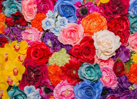 Beautiful multicolored artificial flowers background. flowers decor.の写真素材