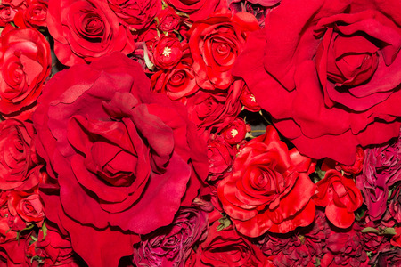 Beautiful artificial flowers background. red flowers pattern.の写真素材