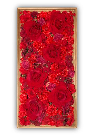 Beautiful red artificial flowers in wooden frame isolated on white background. object with clipping path.の写真素材