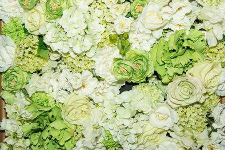 Beautiful green artificial flowers background. flowers decor.の写真素材