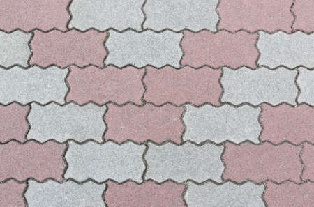concrete floor serrated brick pattern texture for background. Red and gray