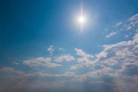 Sky sunlight with white clouds and bright sky blue background.の写真素材